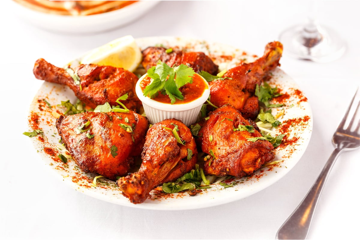 Indian Food Entree of Tandoori Chicken with Herbs on top